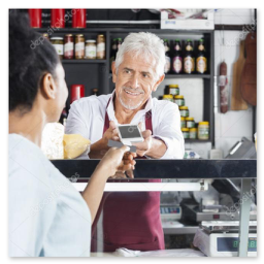 Commerçant utilisant un smartphone dans sa boutique